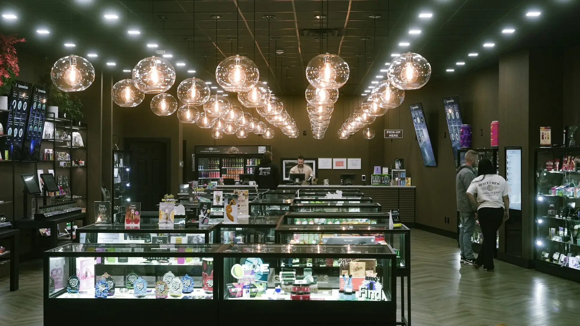Retail store interior with lit display cases and polished floors